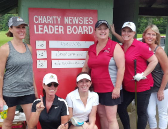 group of ladys posing after playing golf